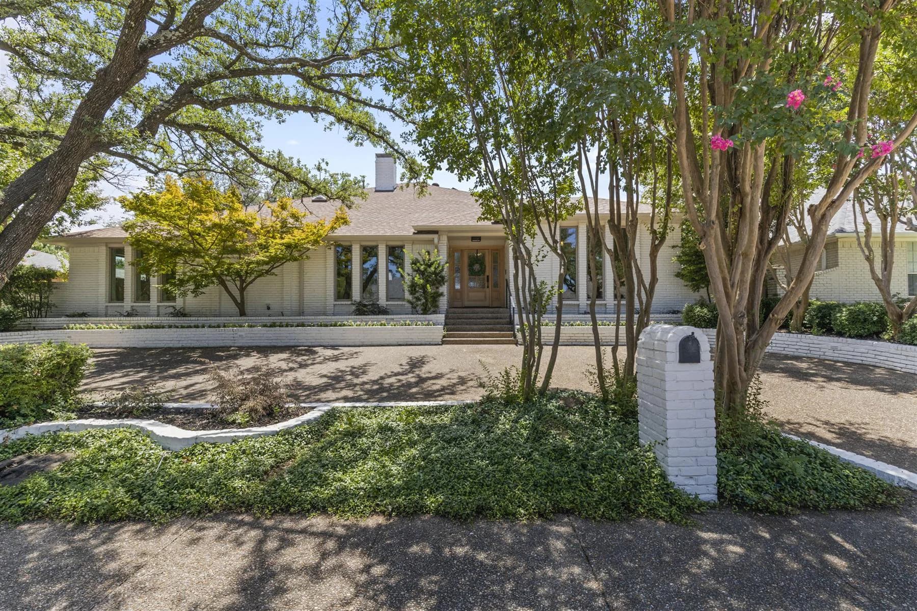 Completed Dallas-Fort Worth residential exterior remodel with updated facade and landscaping